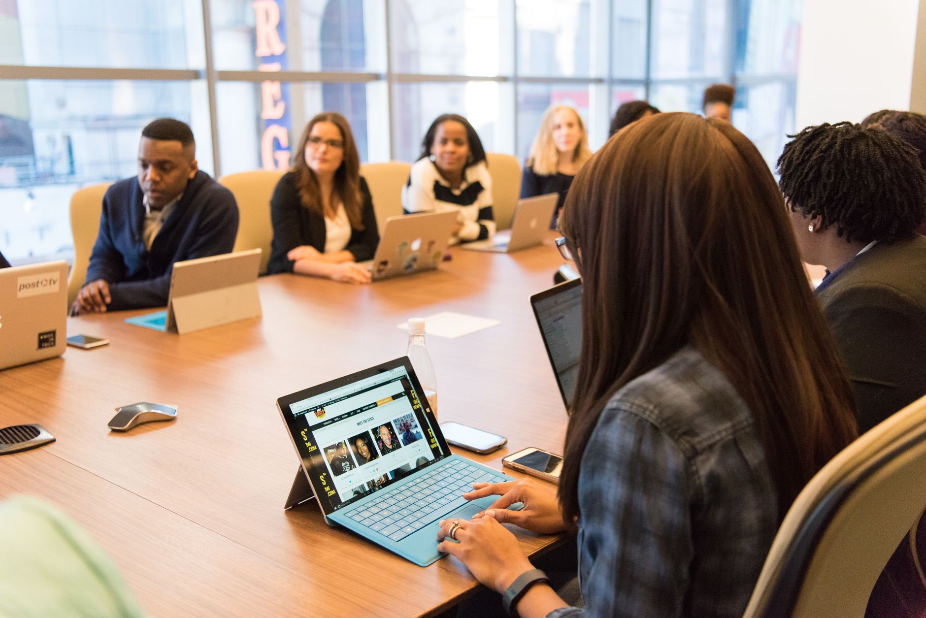 Team collaboration in a tech-driven office, focused on innovation.