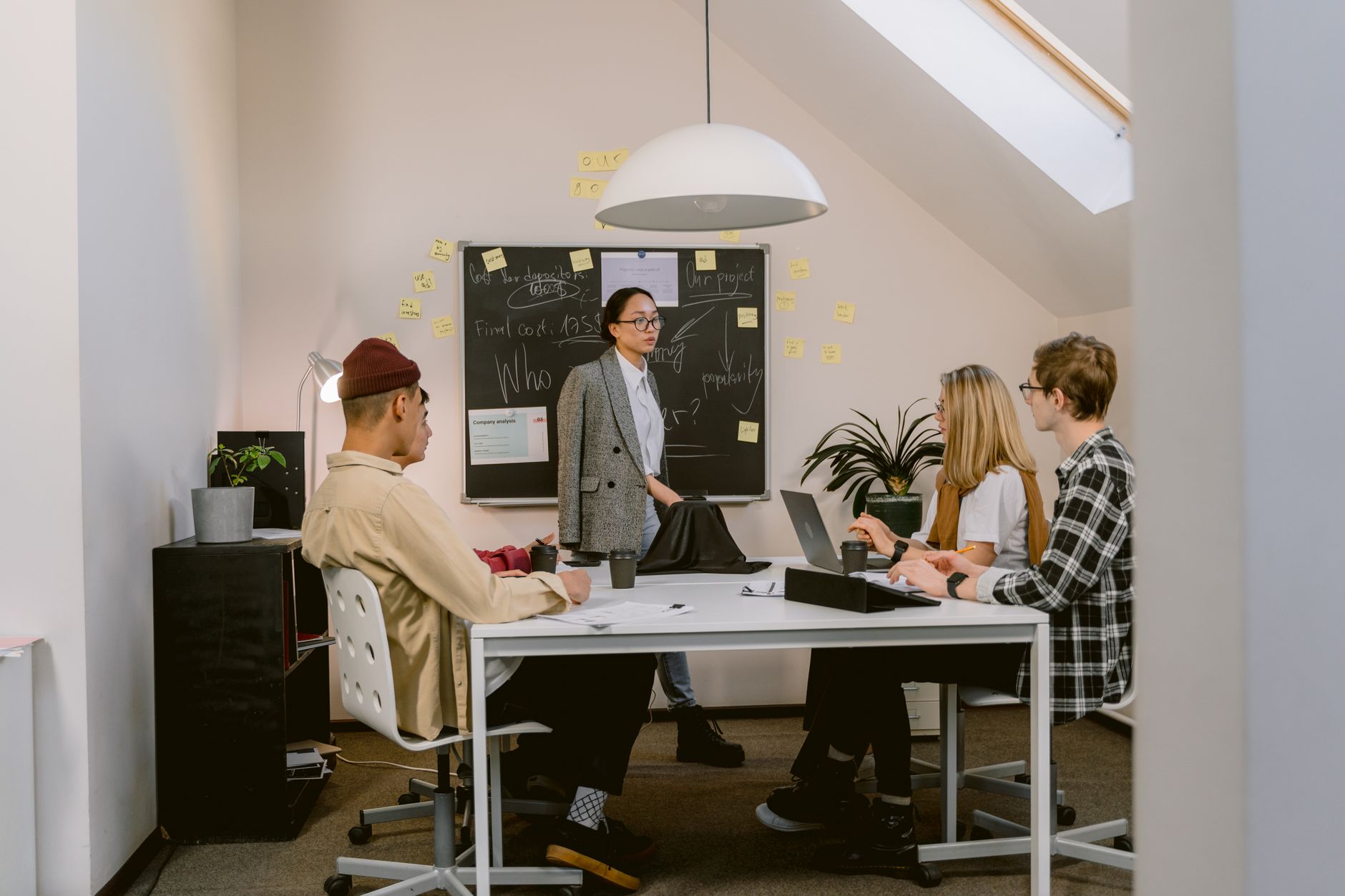 Team members engaged in a creative brainstorming session in a modern office setting.