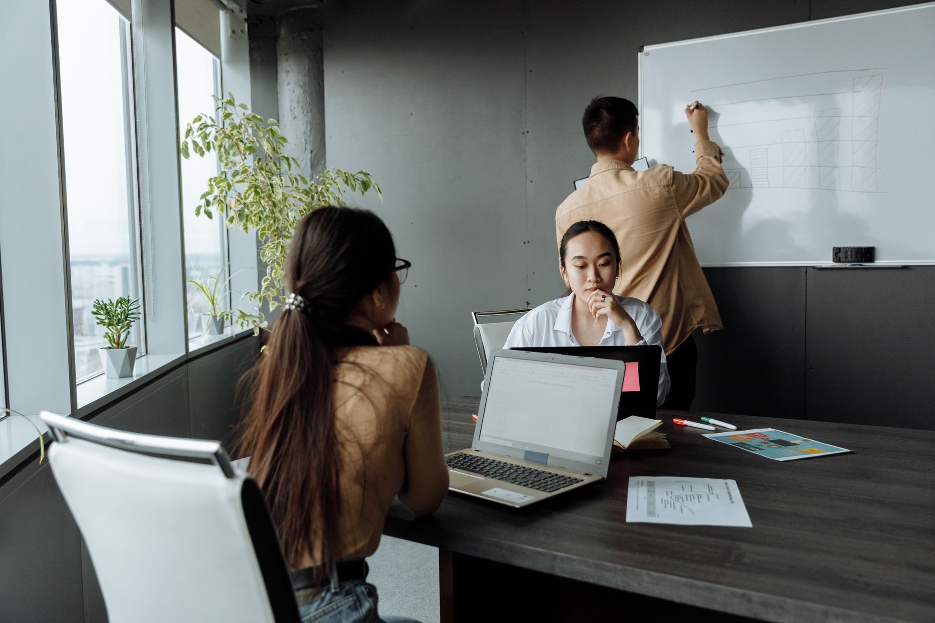 Professional team brainstorming new ideas during a business meeting in a modern office environment.