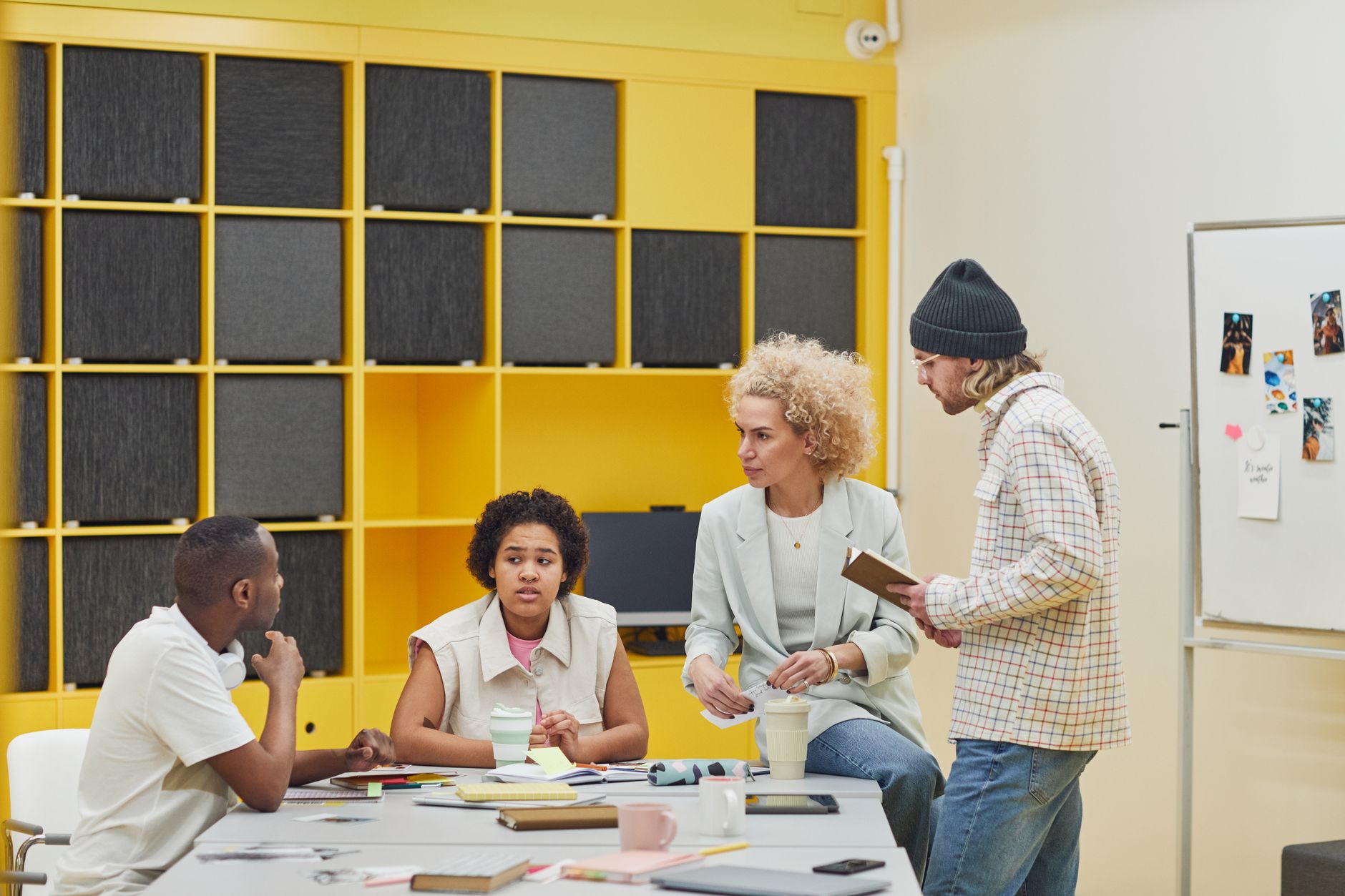 A diverse team of professionals collaborating in a modern, cheerful office environment.