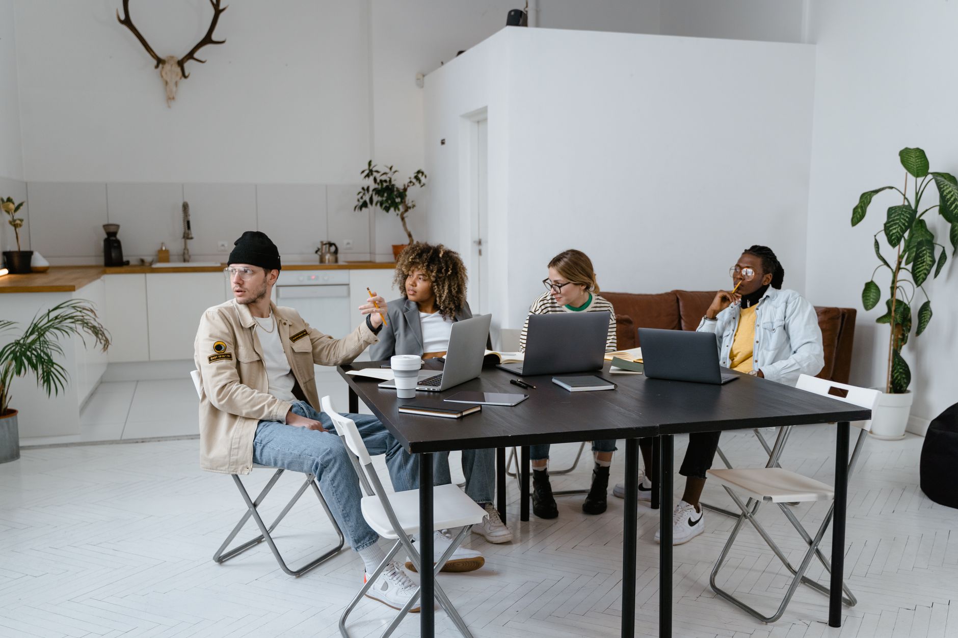 A diverse group of professionals collaborating in a modern and stylish office setting.